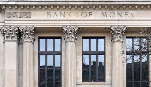 Generic facade of fictitiously named old fashioned bank building with corinthian columns