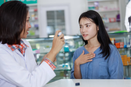 female patient and doctor in pharmacy Thailand