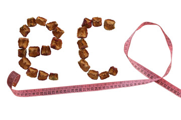 Creative inscription eco made from dried apples and a centimeter. Isolated on a white background.