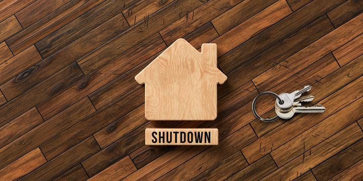 wooden house symbol with text SHUTDOWN on wooden background