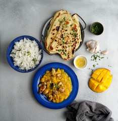 mango curry with chicken and cashew, garlic naan flatbread  and rice
