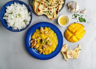 mango curry with chicken and cashew, garlic naan flatbread  and rice