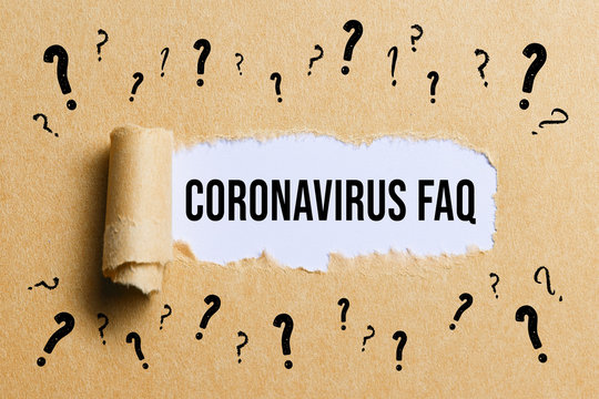 torn paper with many question marks revealing the text CORONAVIRUS-FAQ