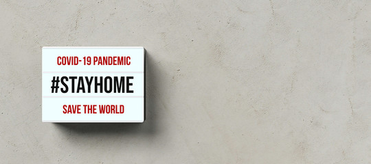 lightbox with text #STAYHOME on concrete background