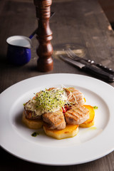grilled chicken breast with potato horseradish sauce and microgreens