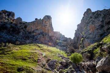 Backlit landscape of stony mountains in the Sierras Subbéticas.