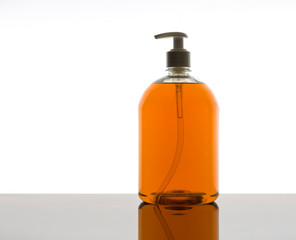 A plastic dispenser with liquid soap  with white background