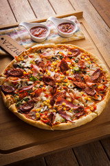 pizza with meat corn onion pepper cheese