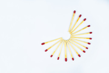 Half circle made with some flammable red fire matches with writable space