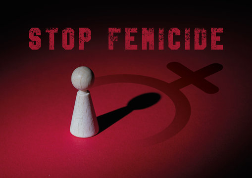 cVoncept that expresses  violence against women. Stop feminicide. Image with red background and dark shadows with female symbol