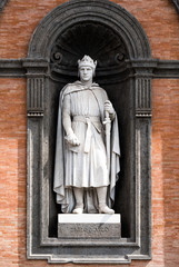 Fototapeta premium Carlo d'Angio statue at the entrance of Royal Palace in Naples, called the Norman. He united under a single kingdom all the Norman conquests in southern Italy, the work of Tommaso Solari of 1888