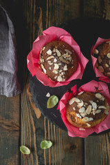 Fresh muffins with marzipan and almonds