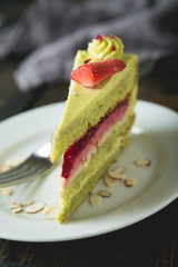 A piece of green cake on the table