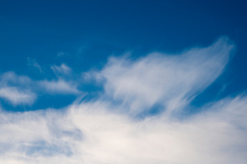 Blue sky with white clouds. Weather event.