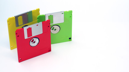 Old floppy disk on a white background.Multi-color floppy disk.