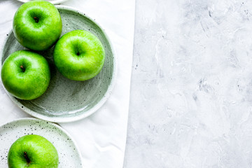 summer food with green apples on stone background top view mock up