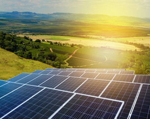 Sunset over Solar energy Farm plant