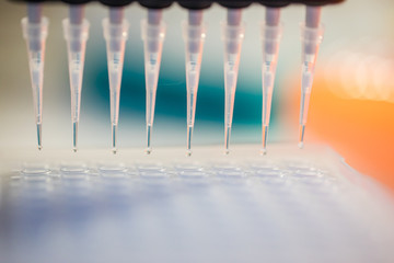 Close up image of laboratory instruments being used to test vaccines and drugs for viruses and DNA