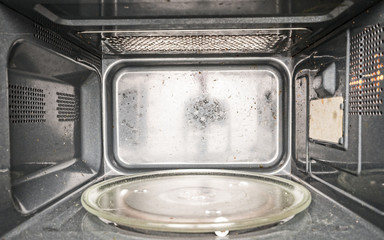 Inside view of unclean, empty microwave