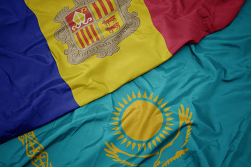 waving colorful flag of kazakhstan and national flag of andorra.