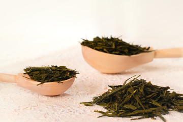 Fototapeta na wymiar Superfood. Dried fermented green tea leaves on a white background with clipping path. Recovery after illness, virus. Strengthening immunity.