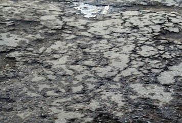 Cracks on the sphalte. Dark texture
