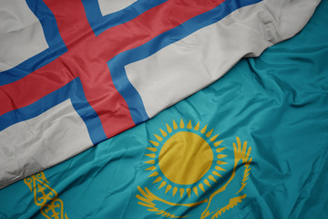 waving colorful flag of kazakhstan and national flag of faroe islands.