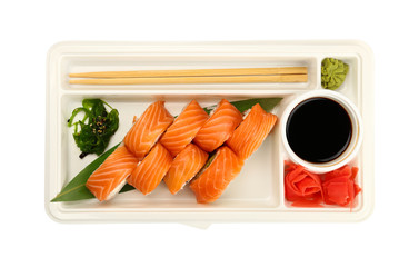 Take away set of salmon sushi rolls on white