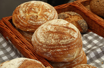 Assorted fresh bread loaves on retail display