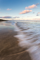 Wide angle close up view of a wave washing up on the very popular holiday destination of Diaz Beach...