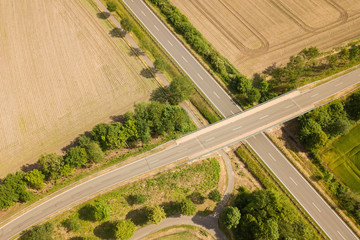 Aerial view of bridge crossing road