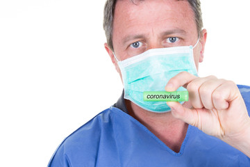 Man doctor chemist hand in blue protective mask hold green test tube white background