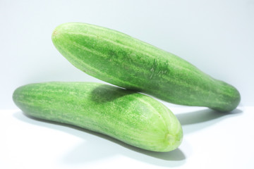 fresh green cucumber on white background