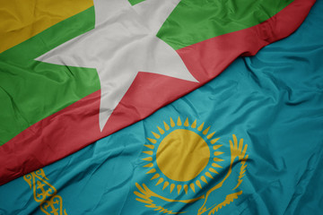 waving colorful flag of kazakhstan and national flag of myanmar.
