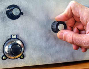 Radio amateur tuning the high frequency power amplifier close up view
