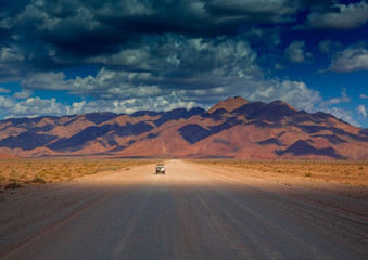 Fototapeta na wymiar Dust road at the namib desert in Namibia