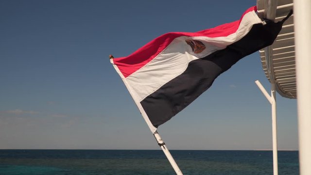 State flag of Egypt on a ship at sea.