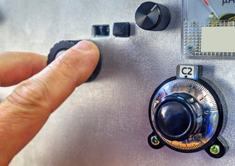 Radio amateur tuning the high frequency power amplifier close up view
