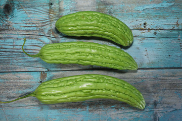 Bitter melon, Bitter gourd on old wood background. with clipping path