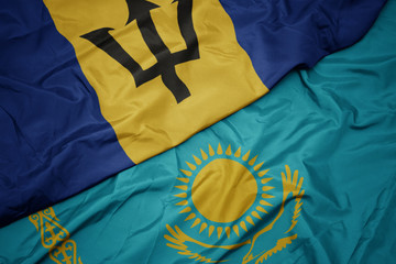 waving colorful flag of kazakhstan and national flag of barbados.