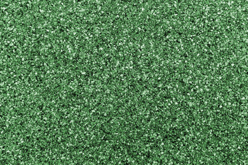 Closeup green bitumen shingle. Rough background made of roofing material