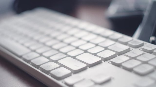 ECU Finger pressing white computer Enter key. Finger pressing multiple times the Enter button on keyboard. Clicks on the keys Enter. Click submit or sent