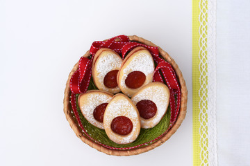 Linzer cookies in Easter shapes, filled with jam and sprinkled with powdered sugar 