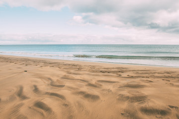 Fototapeta na wymiar Wind-molded beach sand while the sea is calm.Enjoy the life. Copy space. Vacation concept