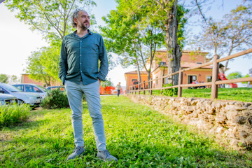 Man in a garden looks at the view