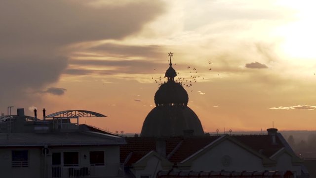 Subotička sinagoga surrounded by birds in Subotica, Serbia
