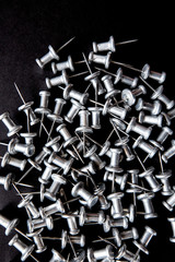 pins and stationery on a black background