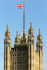 Fototapeta na wymiar The Union Jack flag on top of the Victoria Tower in London, United Kingdom. 