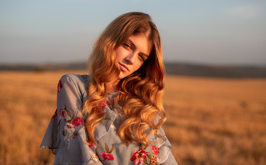 Stylish woman standing in field