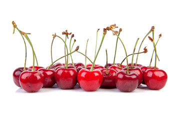 delicious sweet and ripe red cherries over white background